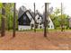 Beautiful two-story modern farmhouse with white brick, black trim, and a spacious yard filled with mature trees at 3268 Sherman Dr, Lancaster, SC 29720