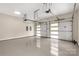 A spacious garage with a painted floor and two modern garage doors at 3268 Sherman Dr, Lancaster, SC 29720