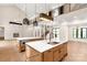 Bright open concept with an elegant kitchen, fireplace, and staircase at 3268 Sherman Dr, Lancaster, SC 29720
