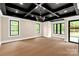 Spacious living room with hardwood floors, black ceiling, and large windows at 3268 Sherman Dr, Lancaster, SC 29720