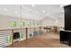 An open loft with hardwood floors and iron railings overlooks the lower level, adding architectural interest at 3268 Sherman Dr, Lancaster, SC 29720