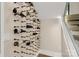 Wine storage with wine rack and wooden pegs, located near the staircase at 3268 Sherman Dr, Lancaster, SC 29720