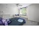 Bright bedroom featuring a large window seat, soft natural light, and tasteful furnishings at 3622 Roxburgh Ln, Gastonia, NC 28056