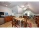 Upstairs bonus room with game table, kitchenette, TVs, and comfortable seating at 3622 Roxburgh Ln, Gastonia, NC 28056