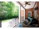 Brick-paved patio with stylish seating, ceiling fan, and a view of the landscaped backyard at 3622 Roxburgh Ln, Gastonia, NC 28056