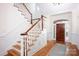 Elegant foyer with staircase, hardwood floors, and custom millwork at 3622 Roxburgh Ln, Gastonia, NC 28056