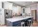 Modern kitchen with white cabinets, a large island, and stainless steel appliances at 3622 Roxburgh Ln, Gastonia, NC 28056