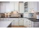 Well-equipped kitchen featuring white cabinets, stainless steel appliances, and dark countertops at 3622 Roxburgh Ln, Gastonia, NC 28056