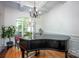 Elegant living room with a piano, beautiful floors, and a large window at 3622 Roxburgh Ln, Gastonia, NC 28056