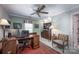 Office space with wood furniture, desk, chair, ceiling fan, and natural light at 3622 Roxburgh Ln, Gastonia, NC 28056