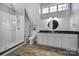 Bathroom with a glass enclosed shower, white and black fixtures, and modern detailing at 4071 Poplar Ridge Dr, Fort Mill, SC 29715