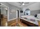 Bedroom featuring hardwood floors, natural light, and attached bathroom and kitchen at 4071 Poplar Ridge Dr, Fort Mill, SC 29715