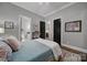 Comfortable bedroom with a rug and view into bathroom and laundry room at 4071 Poplar Ridge Dr, Fort Mill, SC 29715