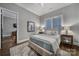 Cozy bedroom featuring hardwood floors, a neutral color palette, and natural light at 4071 Poplar Ridge Dr, Fort Mill, SC 29715