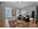 Guest bedroom with natural light, hardwood floors, and black leather chairs at 4071 Poplar Ridge Dr, Fort Mill, SC 29715