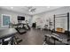 Home gym featuring cardio machines, weightlifting equipment, and natural light at 4071 Poplar Ridge Dr, Fort Mill, SC 29715