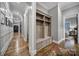 Hallway featuring custom built-in storage with seating and wood floors at 4071 Poplar Ridge Dr, Fort Mill, SC 29715