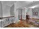 Hallway featuring hardwood floors, craftsman details, and natural light at 4071 Poplar Ridge Dr, Fort Mill, SC 29715
