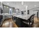 Well-appointed kitchen with an island and bar seating, pendant lights, stainless steel appliances, and custom cabinets at 4071 Poplar Ridge Dr, Fort Mill, SC 29715