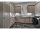 A well-equipped laundry room with ample counter space, custom cabinetry, and modern appliances at 4071 Poplar Ridge Dr, Fort Mill, SC 29715