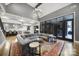 Expansive living room with fireplace and adjoining kitchen shows an open concept layout perfect for entertaining at 4071 Poplar Ridge Dr, Fort Mill, SC 29715