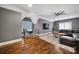 Spacious living room with hardwood floors, stone fireplace, and large TV at 4071 Poplar Ridge Dr, Fort Mill, SC 29715