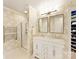 Elegant bathroom featuring a walk-in shower, double vanity, and heated towel rack at 4407 Coventry Row Ct, Charlotte, NC 28270