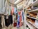 Well-organized walk-in closet with custom shelving for clothing, shoes, and accessories at 4407 Coventry Row Ct, Charlotte, NC 28270