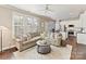 Open-concept living room with comfortable seating, natural light, and seamless flow to the kitchen at 4407 Coventry Row Ct, Charlotte, NC 28270