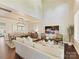 Bright and airy living room features a soaring ceiling, hardwood floors, and a comfortable seating area at 4407 Coventry Row Ct, Charlotte, NC 28270