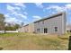 Large grassy backyard with privacy fence, offering ample space for outdoor activities and relaxation at 4538 Opus Ln, Charlotte, NC 28214