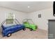 Fun bedroom has twin race car beds, a ceiling fan and closet space at 4538 Opus Ln, Charlotte, NC 28214