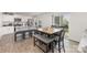 Modern kitchen with stainless steel appliances, granite countertops, and a breakfast bar with seating at 4538 Opus Ln, Charlotte, NC 28214