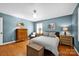 Inviting bedroom showcases a well-appointed layout and is adorned with art and ambient lighting at 4937 Broken Saddle Ln, Charlotte, NC 28226