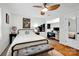 This is a bedroom with a workstation, ceiling fan, and hardwood floors at 4937 Broken Saddle Ln, Charlotte, NC 28226