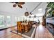 Open dining area with hardwood floors, skylights, and modern light fixtures, perfect for Gathering meals or entertaining guests at 4937 Broken Saddle Ln, Charlotte, NC 28226