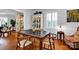 Charming dining room with classic hardwood floors, vintage furnishings, and natural light at 4937 Broken Saddle Ln, Charlotte, NC 28226