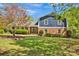 Charming two-story home with a brick facade and a well-manicured lawn, complemented by mature trees at 4937 Broken Saddle Ln, Charlotte, NC 28226