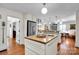 Bright, spacious kitchen with stainless steel appliances, butcher block island, and wood floors at 4937 Broken Saddle Ln, Charlotte, NC 28226