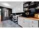 Office space with cabinets, modern appliances, and wood countertop work area for functional design at 4937 Broken Saddle Ln, Charlotte, NC 28226