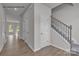 The entryway features hardwood floors and a staircase leading to the upper level at 5345 Cherrie Kate Ct # 1804, Stanley, NC 28164