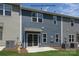 The new construction features a sliding glass door leading to the patio and siding in two complementary colors at 5345 Cherrie Kate Ct # 1804, Stanley, NC 28164