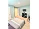 A bedroom with blue walls, carpet, and a TV on a black stand at 5861 Camp Sw Ct, Concord, NC 28025