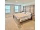 A large bedroom with a statement headboard and plush carpet at 5861 Camp Sw Ct, Concord, NC 28025