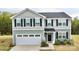 Charming two-story home with gray siding, black shutters, and a welcoming two-car garage at 5861 Camp Sw Ct, Concord, NC 28025
