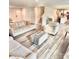 Open-concept living room with contemporary furniture and wood-look flooring, ideal for relaxing and entertaining at 5861 Camp Sw Ct, Concord, NC 28025
