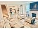 Spacious living room with a fireplace and views into kitchen with modern finishes and staircase at 5861 Camp Sw Ct, Concord, NC 28025