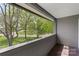 Outdoor balcony featuring scenic views of the community and mature trees at 6605 Point Comfort Ln, Charlotte, NC 28226