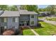 Attractive two-story condo with a covered entryway and a green front yard at 6605 Point Comfort Ln, Charlotte, NC 28226