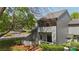 Charming exterior view of a two-story home with a wooden deck and mature trees at 6605 Point Comfort Ln, Charlotte, NC 28226